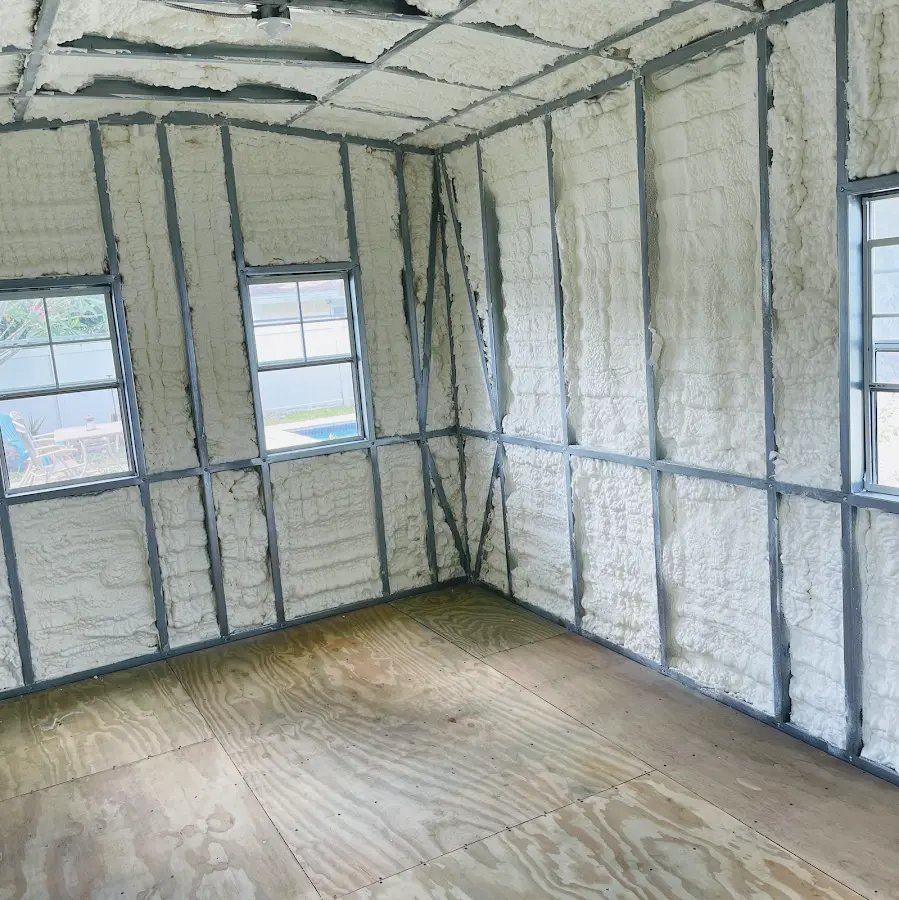 Closed-cell spray foam insulation applied to wall cavities in a residential project in Hamilton